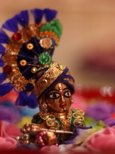 Close-up of a vibrant Hindu deity figurine, showcasing intricate details and cultural significance.